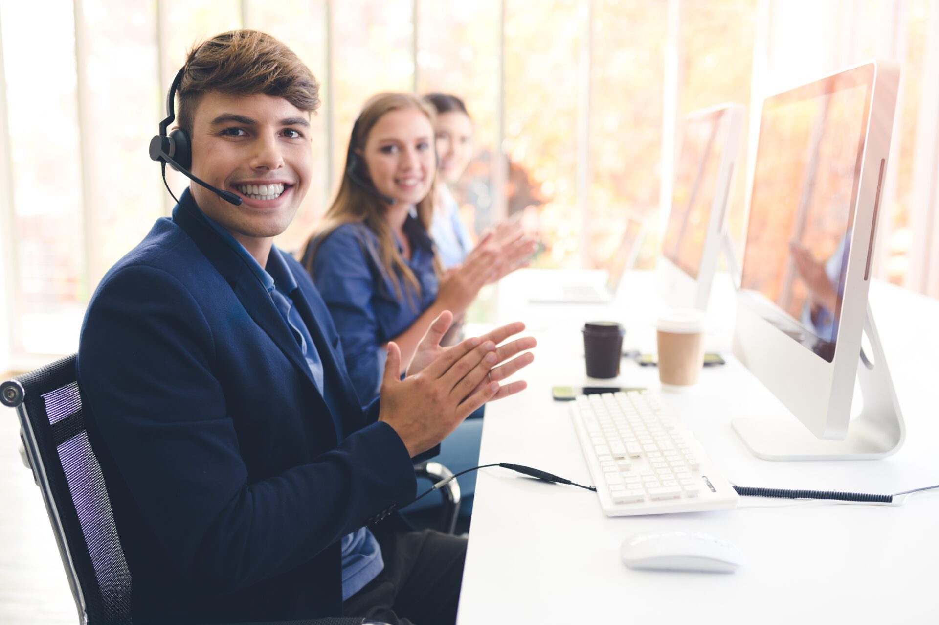 132070072_l Call Center Service. Photo of customer support or sales agent. Help line answering and telemarketing. Male caller or receptionist phone operator.Copy space for some text, advertising or slogan.