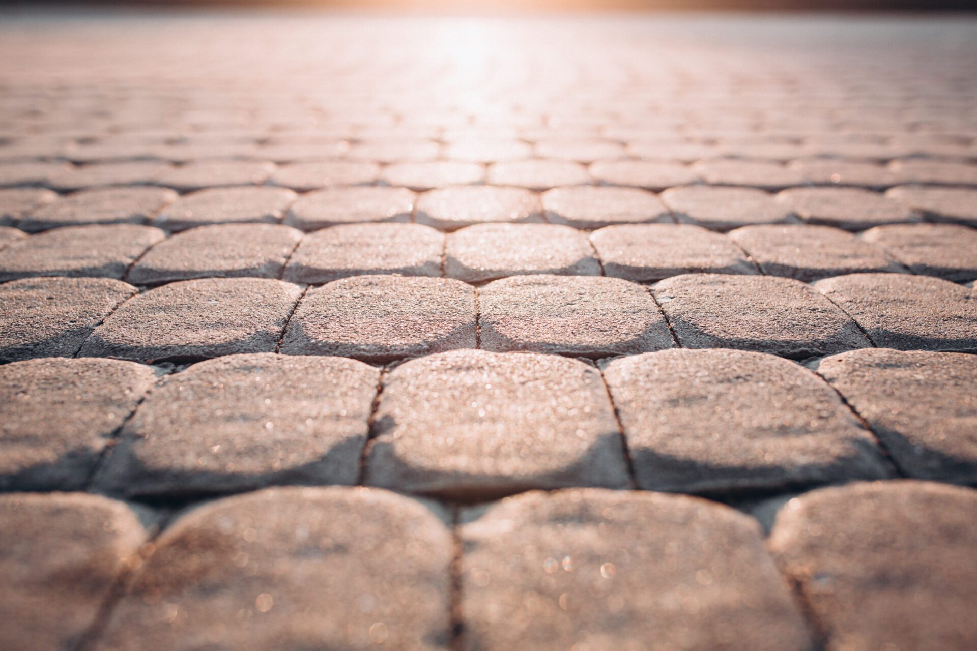 paving stones in the park. ideal road for walking. sun glare paving stones in the park. ideal road for walking. sun glare